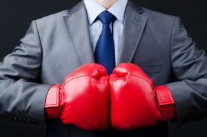 Businessman with red boxing gloves